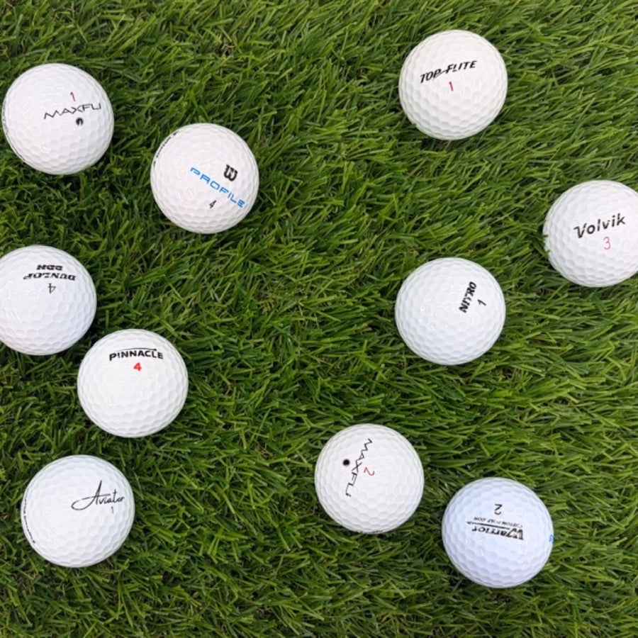 White Golf Balls On Grass