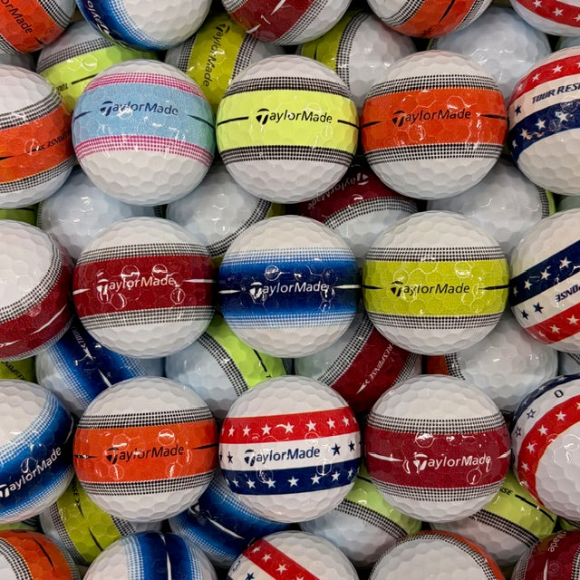 Stack of TaylorMade golf balls in various colors and designs.