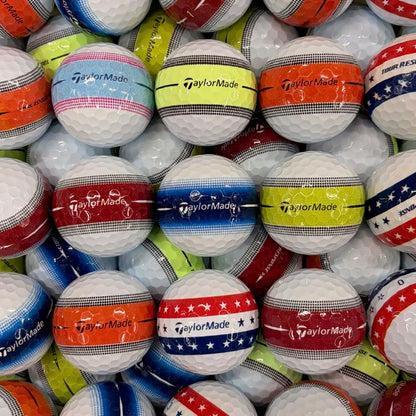 Stack of TaylorMade golf balls in various colors and designs.